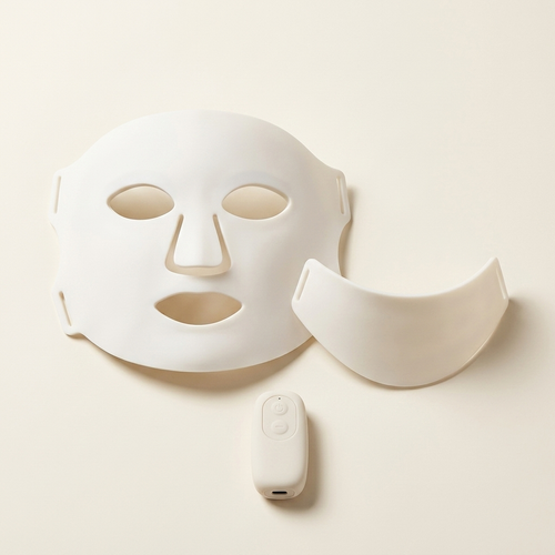 PURE SOL. silicone LED face mask with neck piece and USB-C controller on ivory background